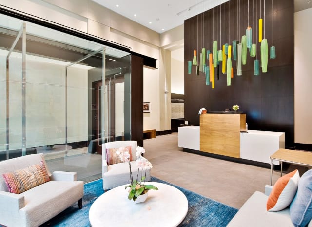 Modern attended lobby with elegant seating area and colorful art installation